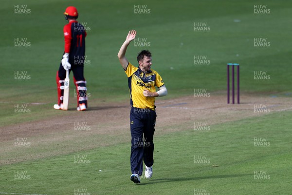 310722 - Wales National County v Glamorgan - One Day Tour Match - Joe Cooke of Glamorgan celebrates after Connor Brown is caught by Chris Cooke
