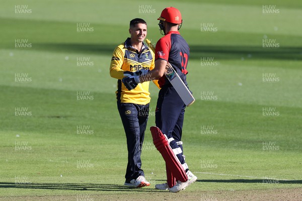 310722 - Wales National County v Glamorgan - One Day Tour Match - Kiran Carlson of Glamorgan shakes hands with Ben Morris after the match