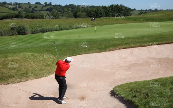 03.06.11 -SAAB Wales Open 2011, Celtic Manor Resort, Newport -  Wales' Simon Edwards plays out of a bunker onto the 14th green 