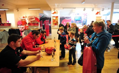 180412- Wales players signing- Jamie Roberts, Lou Reed and Huw Bennett signing autographs at the Cardiff Arms Shop