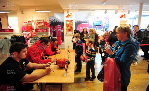 180412- Wales players signing- Jamie Roberts, Lou Reed and Huw Bennett signing autographs at the Cardiff Arms Shop