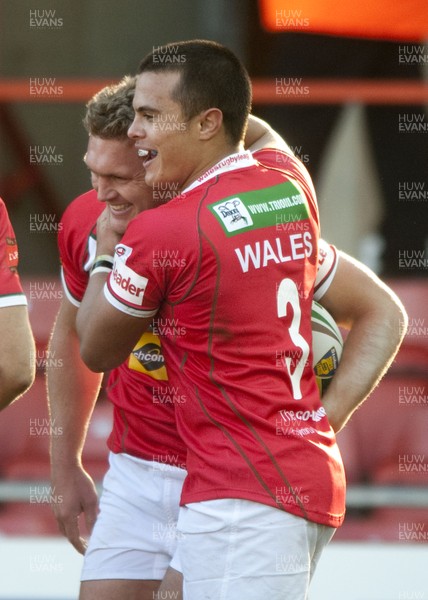 251012 -  Wales v England - Rugby League -     Christian Roets of Wales, left, is congratulated by Mike Channing after scoring  