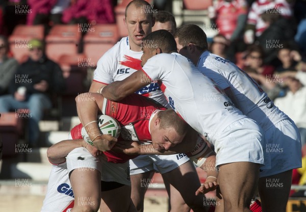 251012 -  Wales v England - Rugby League -     Gil Dudson of Wales is tackled by four England players  