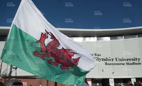 251012 -  Wales v England - Rugby League -     A Wales flag flies in the breeze outside The Racecourse stadium, Wrexham before the match between Wales and England  