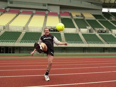 050601 - Wales Rugby Training - Iestyn Thomas attempts his skill with a different shaped ball during training at the Nagai Stadium in Osaka