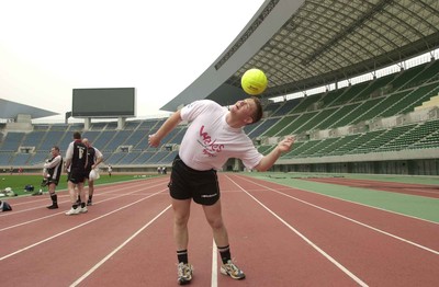 050601 - Wales Rugby Training - Phil Booth attempts to control the 'wrong-shaped' ball during training at the Nagai Stadium in Osaka