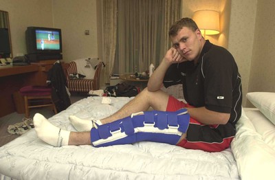 050601 - Wales Rugby Training - Wing Craig Morgan sits in his hotel room in Osaka with his injured leg strapped up which has ruled him out of the rest of the tour