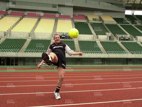 050601 - Wales Rugby Training - Iestyn Thomas attempts his skill with a different shaped ball during training at the Nagai Stadium in Osaka