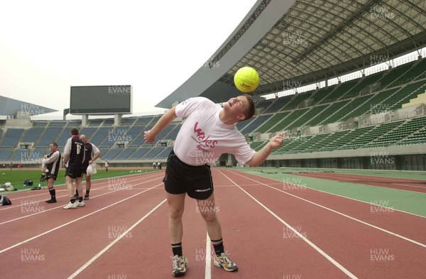 050601 - Wales Rugby Training - Phil Booth attempts to control the 'wrong-shaped' ball during training at the Nagai Stadium in Osaka