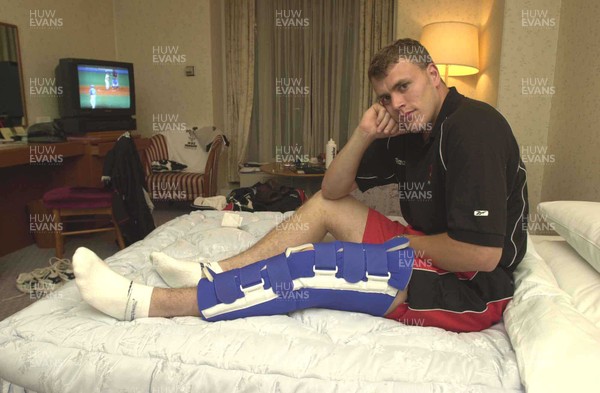 050601 - Wales Rugby Training - Wing Craig Morgan sits in his hotel room in Osaka with his injured leg strapped up which has ruled him out of the rest of the tour