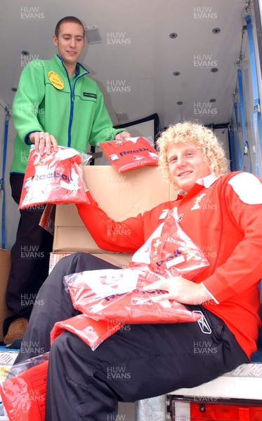 051103 - Wales' Duncan Jones, Richard Forsyth from ASDA load up with Wales rugby jerseys to go on sale before the match against England on Sunday