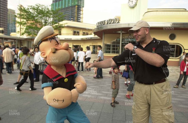 070601  Wales Rugby Tour to Japan - Craig Quinnell takes a shot at Popeye during a visit to the Universal Studios in Osaka