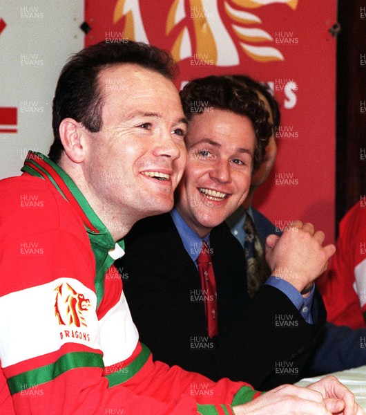 130395 - Wales Rugby Media Interviews - Singer Michael Ball, who will lead the Welsh players in their World Cup theme 'Bread of Heaven', pictured with Ieuan Evans (left) at Cardiff Arms Park