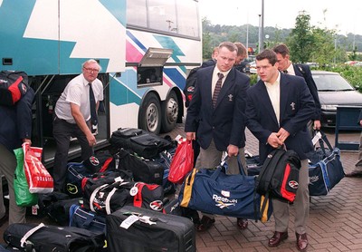 290698 - Wales Rugby team arrive home -  Kingsley Jones and Byron Hayward collect their bags as the Welsh team arrive home from South Africa