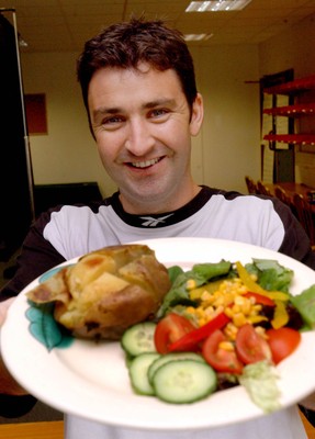 310703 - Wales fitness coach Andrew Hoare with one of the healthy meals the players are given as part of their fitness programme