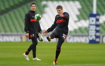 04.02.12 - Wales Rugby Captains Run -.Rhys Priestland kicks as James Hook look on during training..