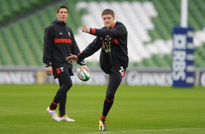 04.02.12 - Wales Rugby Captains Run -.Rhys Priestland kicks as James Hook look on during training..