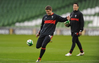 04.02.12 - Wales Rugby Captains Run -.Rhys Priestland kicks as James Hook look on during training..