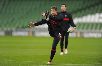 04.02.12 - Wales Rugby Captains Run -.Rhys Priestland kicks as James Hook look on during training..