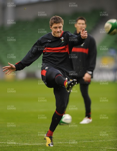 04.02.12 - Wales Rugby Captains Run -.Rhys Priestland kicks as James Hook look on during training..