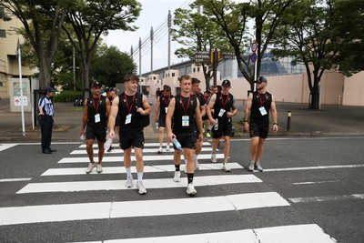 040725 - Wales Rugby walk to the stadium for their Captains Run at Mikuni World Stadium ahead of the game against Japan - Dan Edwards and Cameron Winnett, 
