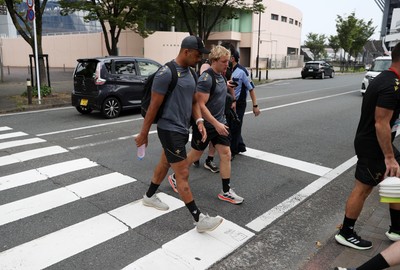 040725 - Wales Rugby walk to the stadium for their Captains Run at Mikuni World Stadium ahead of the game against Japan - Ben Thomas and Blair Murray