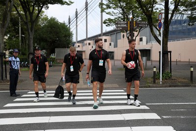 040725 - Wales Rugby walk to the stadium for their Captains Run at Mikuni World Stadium ahead of the game against Japan - Sam Costelow, Johnny Williams and Kieran Hardy