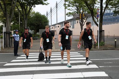040725 - Wales Rugby walk to the stadium for their Captains Run at Mikuni World Stadium ahead of the game against Japan - Sam Costelow, Johnny Williams and Kieran Hardy