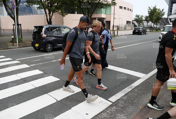 040725 - Wales Rugby walk to the stadium for their Captains Run at Mikuni World Stadium ahead of the game against Japan - Ben Thomas and Blair Murray