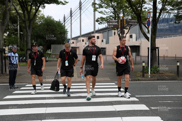 040725 - Wales Rugby walk to the stadium for their Captains Run at Mikuni World Stadium ahead of the game against Japan - Sam Costelow, Johnny Williams and Kieran Hardy
