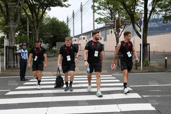 040725 - Wales Rugby walk to the stadium for their Captains Run at Mikuni World Stadium ahead of the game against Japan - Sam Costelow, Johnny Williams and Kieran Hardy