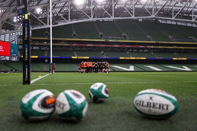050326 - Wales Rugby Captains Run ahead of their Six Nations game against Ireland tomorrow evening - Wales team huddle in the Aviva Stadium