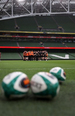 050326 - Wales Rugby Captains Run ahead of their Six Nations game against Ireland tomorrow evening - Wales team huddle in the Aviva Stadium