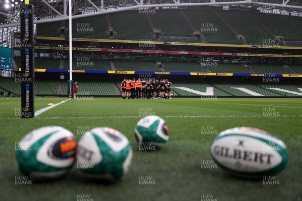 050326 - Wales Rugby Captains Run ahead of their Six Nations game against Ireland tomorrow evening - Wales team huddle in the Aviva Stadium