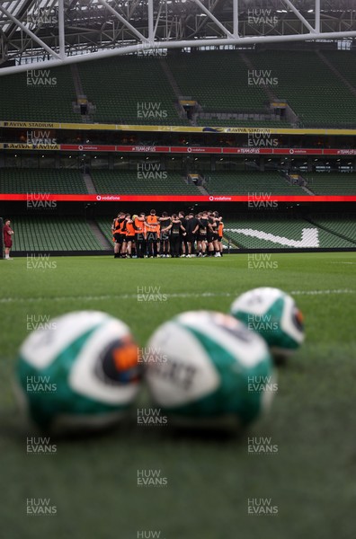 050326 - Wales Rugby Captains Run ahead of their Six Nations game against Ireland tomorrow evening - Wales team huddle in the Aviva Stadium