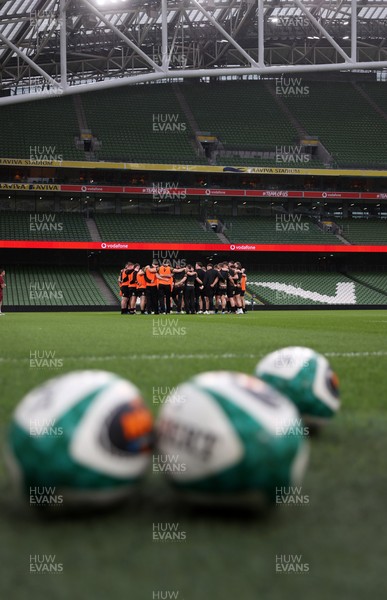050326 - Wales Rugby Captains Run ahead of their Six Nations game against Ireland tomorrow evening - Wales team huddle in the Aviva Stadium