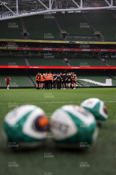 050326 - Wales Rugby Captains Run ahead of their Six Nations game against Ireland tomorrow evening - Wales team huddle in the Aviva Stadium
