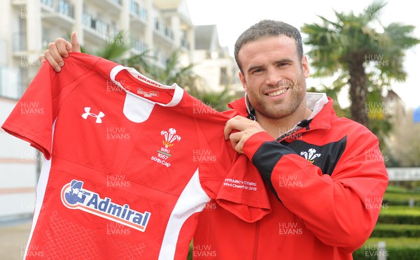 080213 - Wales Rugby Captains Run -Jamie Roberts with a Wales jersey that show he will be playing for his 50th cap tomorrow