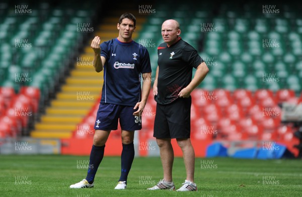 12.08.11 - Wales Rugby Captains Run - James Hook talks to kicking coach Neil Jenkins during training. 