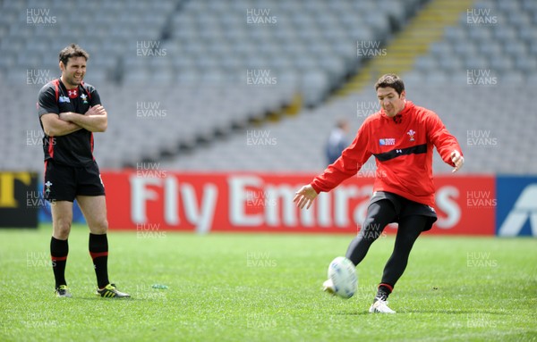 14.10.11 - Wales Rugby Captains Run - James Hook kicks as Stephen Jones looks on during training. 