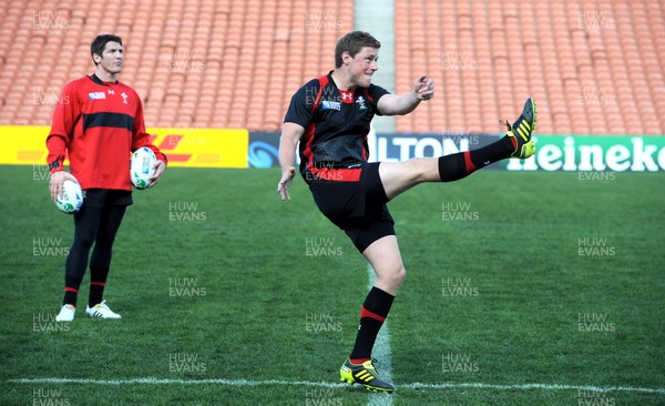 17.09.11 - Wales Rugby Captains Run - Rhys Priestland kicks as James Hook looks on during training. 