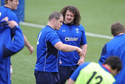 18.03.11 - Wales Rugby Captains Run - Paul James talks to Adam Jones(R) during training. 