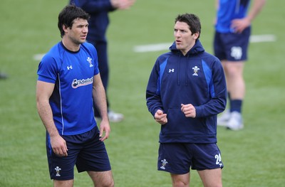 18.03.11 - Wales Rugby Captains Run - Mike Phillips talks to James Hook(R) during training. 