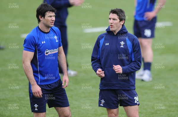 18.03.11 - Wales Rugby Captains Run - Mike Phillips talks to James Hook(R) during training. 