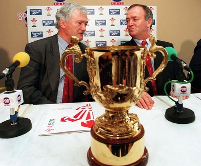 310798 - Wales Rugby -  New Wales coach Graham Henry (right) at today's press conference in Cardiff, with Glanmor Griffiths, WRU Chairman, and the Webb Ellis Cup