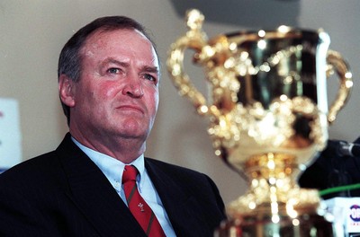 310798 - Wales Rugby -  New Wales coach Graham Henry (left) at today's press conference in Cardiff, with the Webb Ellis Cup