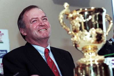 310798 - Wales Rugby -  New Wales coach Graham Henry (left) at today's press conference in Cardiff, with the Webb Ellis Cup