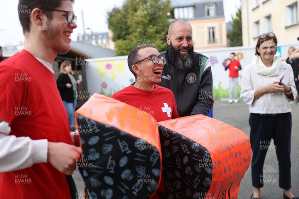 041023 - Picture shows the Wales Rugby Team visiting IME Le Rondo Croix Rouge in Versailles, a school for children with disabilities - 