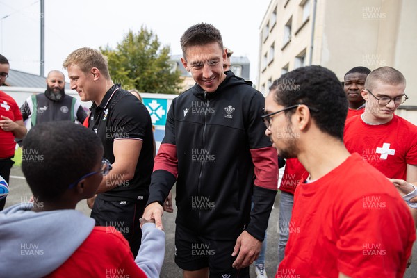 041023 - Picture shows the Wales Rugby Team visiting IME Le Rondo Croix Rouge in Versailles, a school for children with disabilities - Josh Adams with pupils