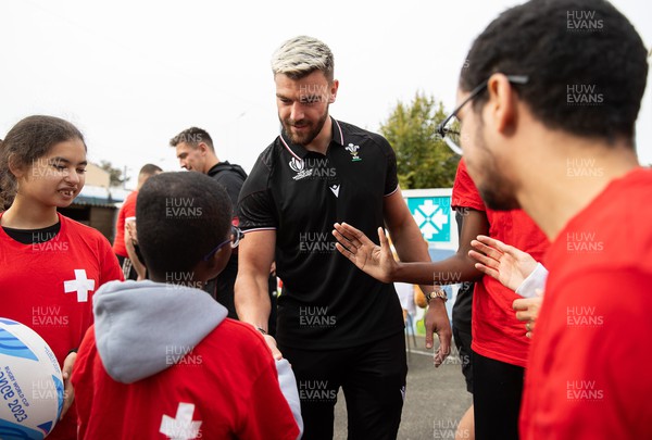 041023 - Picture shows the Wales Rugby Team visiting IME Le Rondo Croix Rouge in Versailles, a school for children with disabilities - Johnny Williams with pupils